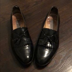 Men’s black tassel dress loafers by Bruno Magli